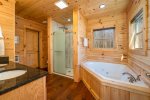 Ensuite Primary Bathroom with Garden Tub and Stand-Up Shower